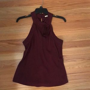 A high neck sleeveless blouse